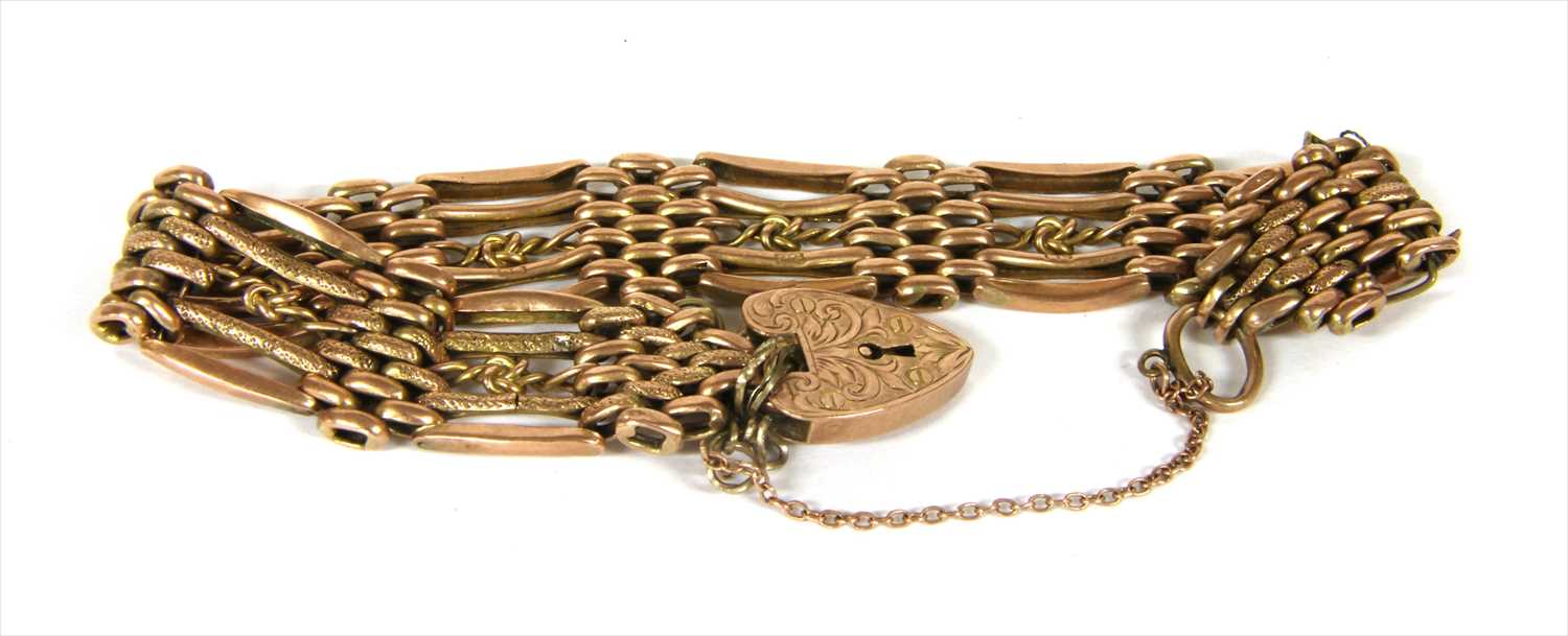 Lot 8 - A gold five row gate bracelet