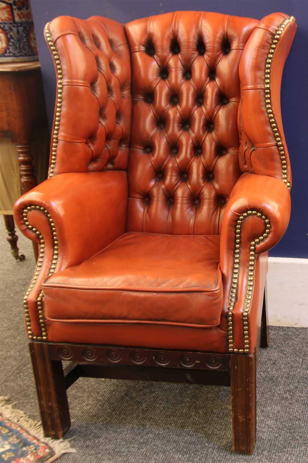 Lot 502 - A miniature George III style button back wing back armchair