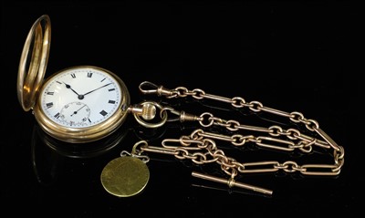 Lot 573 - A 9ct gold top wind hunter pocket watch