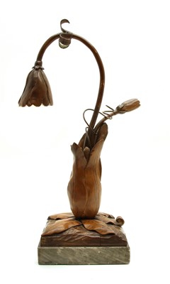 Lot 220 - A French carved walnut Art Nouveau table lamp