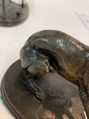 Lot 190 - A bronze model of a whippet with a ball