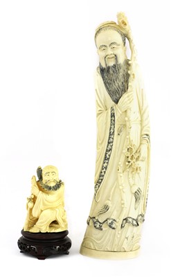 Lot 132 - A Chinese carved figure of a man