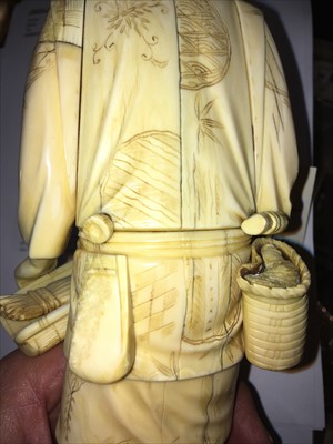 Lot 126 - A Japanese carved ivory figure of a vegetable seller