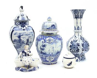 Lot 329 - A Delft vase and cover with pictoral reserves