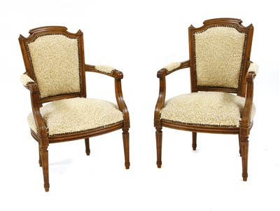 Lot 1697 - A pair of French walnut armchairs