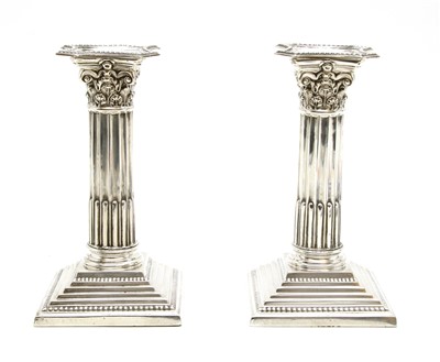 Lot 191 - A pair of silver dwarf candlesticks