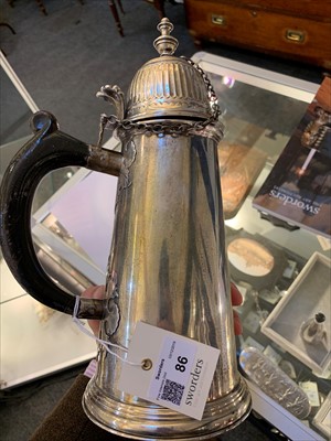 Lot 86 - A large silver cut card coffee pot in the George I style