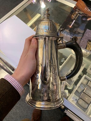 Lot 86 - A large silver cut card coffee pot in the George I style