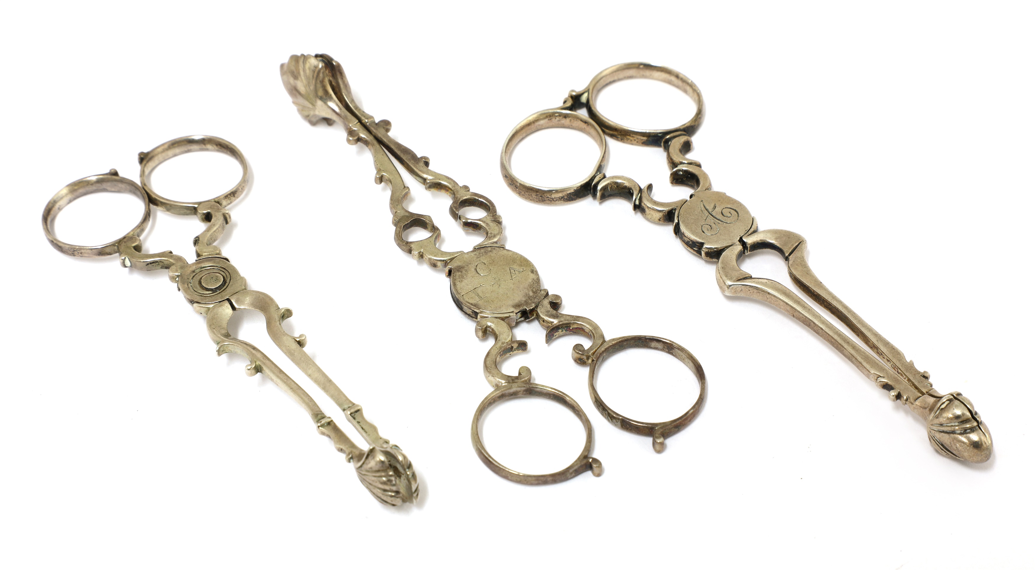 Lot 52 A pair of silver sugar nips,