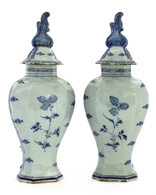 Lot 272 - A pair of Dutch delft vases and covers