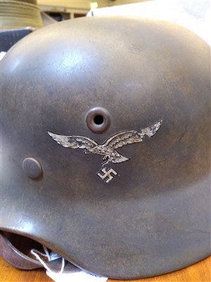 Lot 173 - A Dunkirk period German original Luftwaffe combat M35 rolled edge helmet with liner