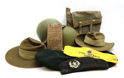 Lot 184 - A box of various WWII and later mainly helmets and berets