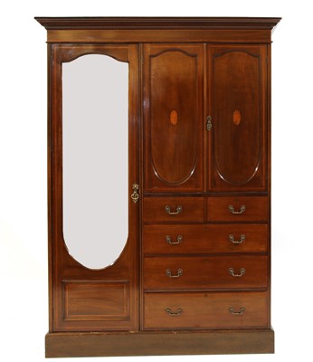 Lot 1604 - An Edwardian mahogany and crossbanded compactum wardrobe