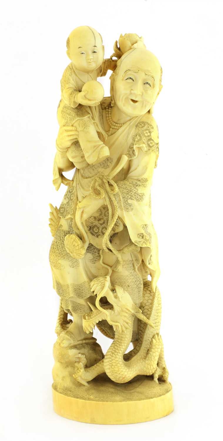 Lot 128 - A Japanese carved ivory group