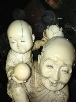 Lot 128 - A Japanese carved ivory group