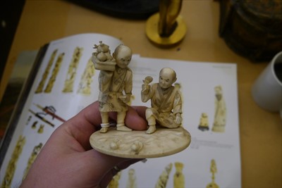 Lot 130 - Two Japanese carved ivory sectional figures