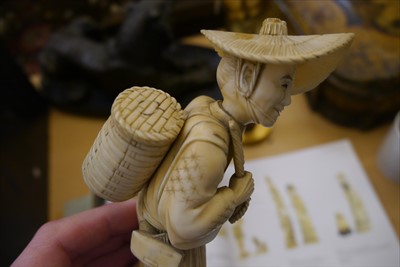 Lot 130 - Two Japanese carved ivory sectional figures