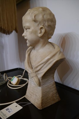Lot 222 - A carved alabaster figure of a boy