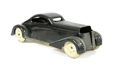 Lot 1181 - A black tin wind up car