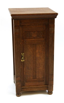 Lot 624 - A Gillows style oak bedside cabinet