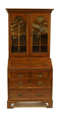 Lot 619 - A Victorian inlaid oak and mahogany bureau bookcase