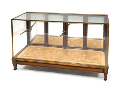 Lot 510 - A brass and glazed shop display cabinet