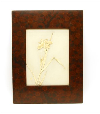 Lot 644 - A Japanese ivory panel with applied iris