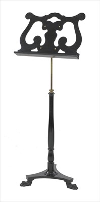 Lot 542 - An ebonised music stand