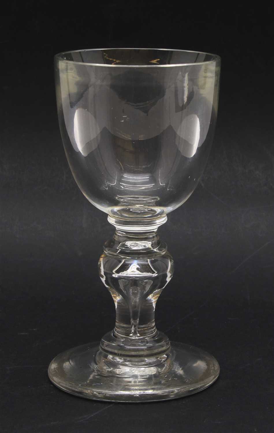 Lot 135 - An early 18th century English heavy baluster glass