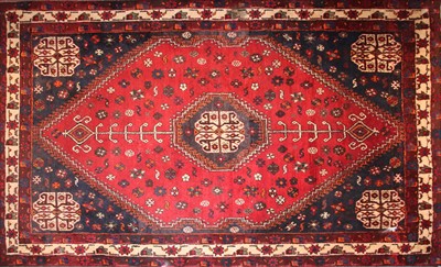 Lot 679 - A red ground Persian rug