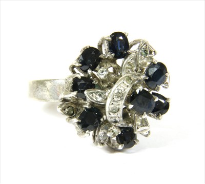 Lot 55 - A white metal sapphire cluster ring