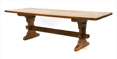 Lot 781 - An eight seater light oak refectory table