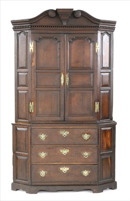 Lot 492 - An 18th century oak standing corner cupboard