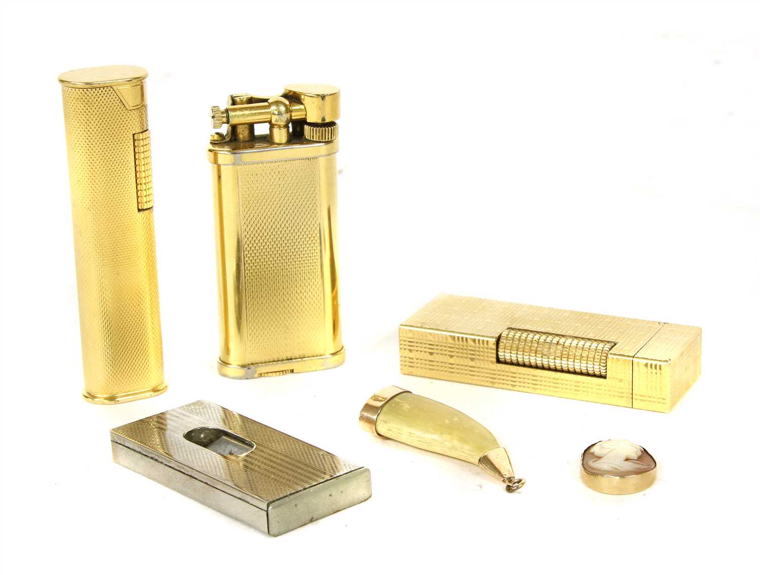 Lot 1025 - Three gold plated Dunhill lighters