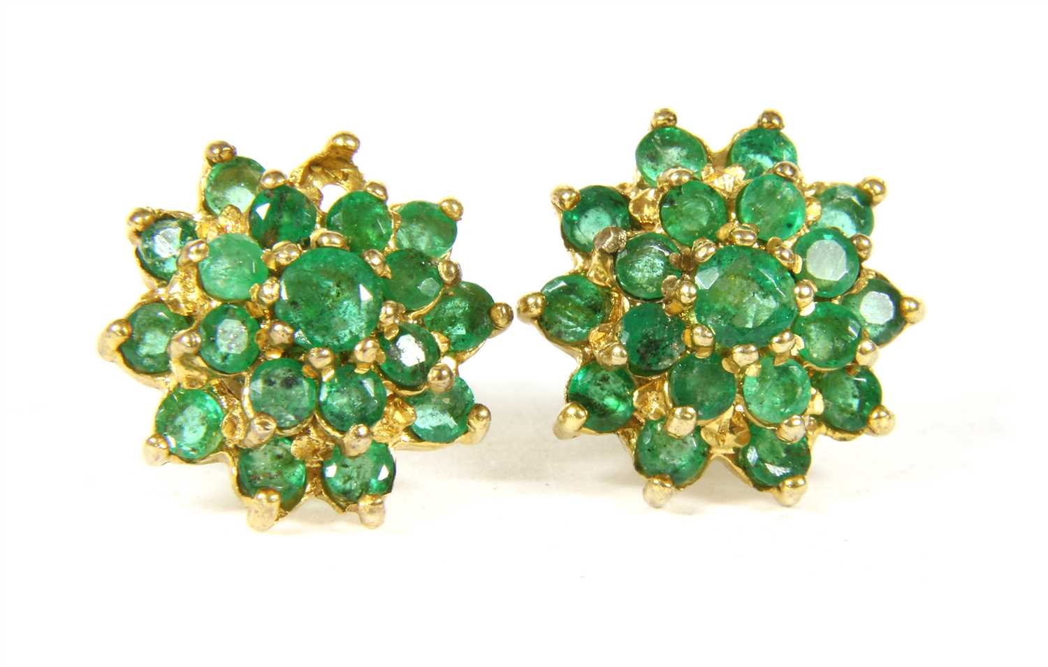 Lot 1017 - A pair of 9ct gold emerald cluster earrings