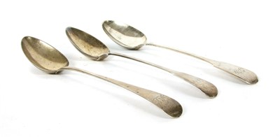 Lot 1148 - Three George III silver basting spoons