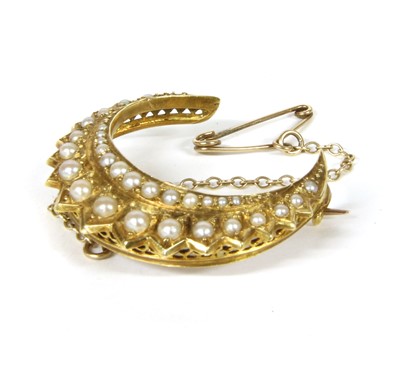 Lot 1042 - A Victorian 18ct gold split pearl crescent brooch