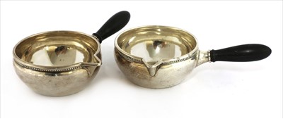 Lot 193 - A pair of sterling silver brandy warmers
