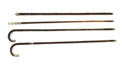Lot 1434 - A collection of four silver mounted imitation bamboo sword sticks