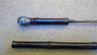 Lot 1434 - A collection of four silver mounted imitation bamboo sword sticks