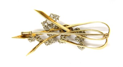 Lot 64 - A gold sapphire and diamond spray brooch