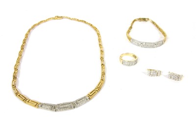 Lot 1064 - A gold, silver and curbic zirconia Greek key design ring, earring, necklace and bracelet suite