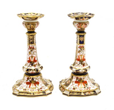 Lot 1351 - A pair of Royal Crown Derby Imari candlesticks