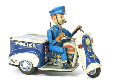 Lot 1167 - A Japanese tinplate police patrol auto tricycle