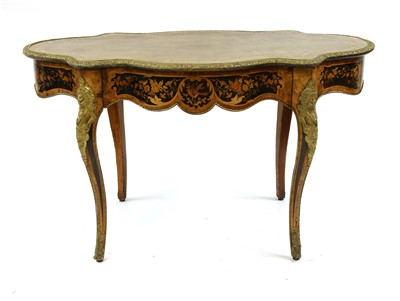 Lot 1643 - A Louis XV style walnut marquetry bureau plat