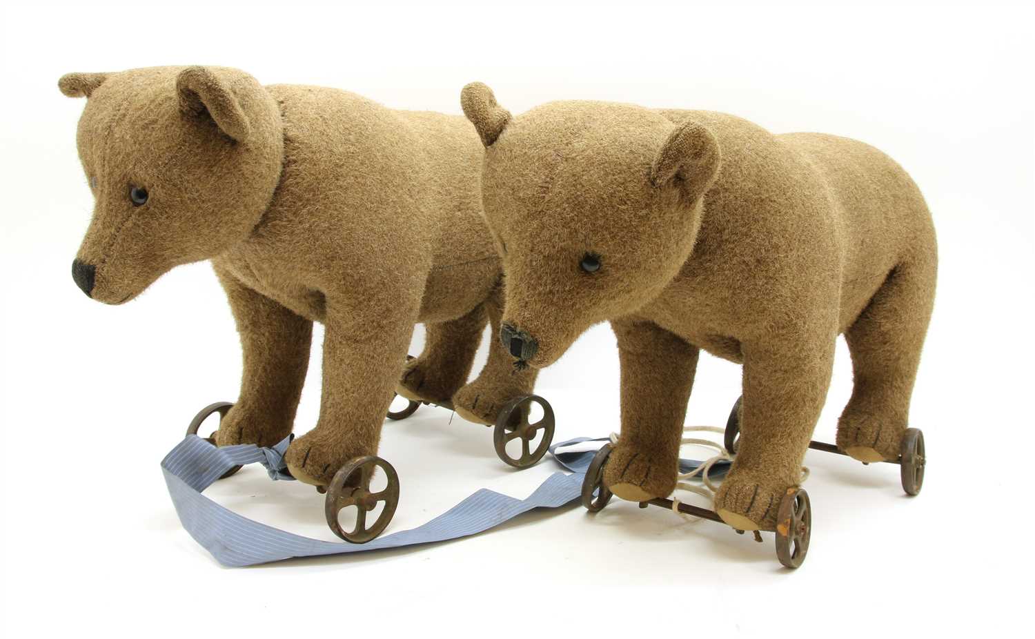 Lot 1266 - A pair of Steiff bears on wheels