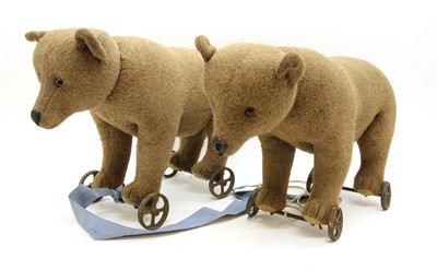 Lot 1266 - A pair of Steiff bears on wheels