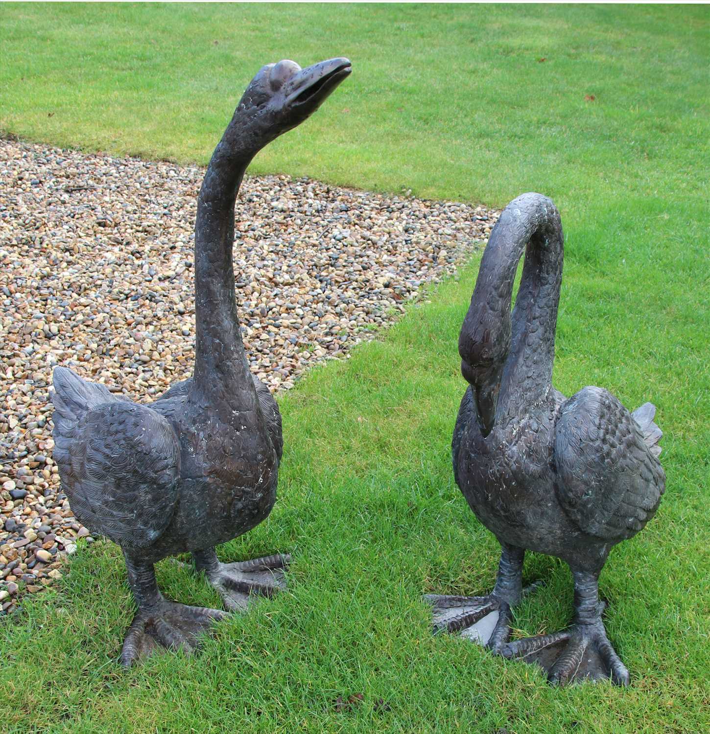 Lot 655 - Two case bronze swans