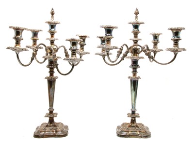 Lot 1134 - A pair of silver plated four branch candelabra