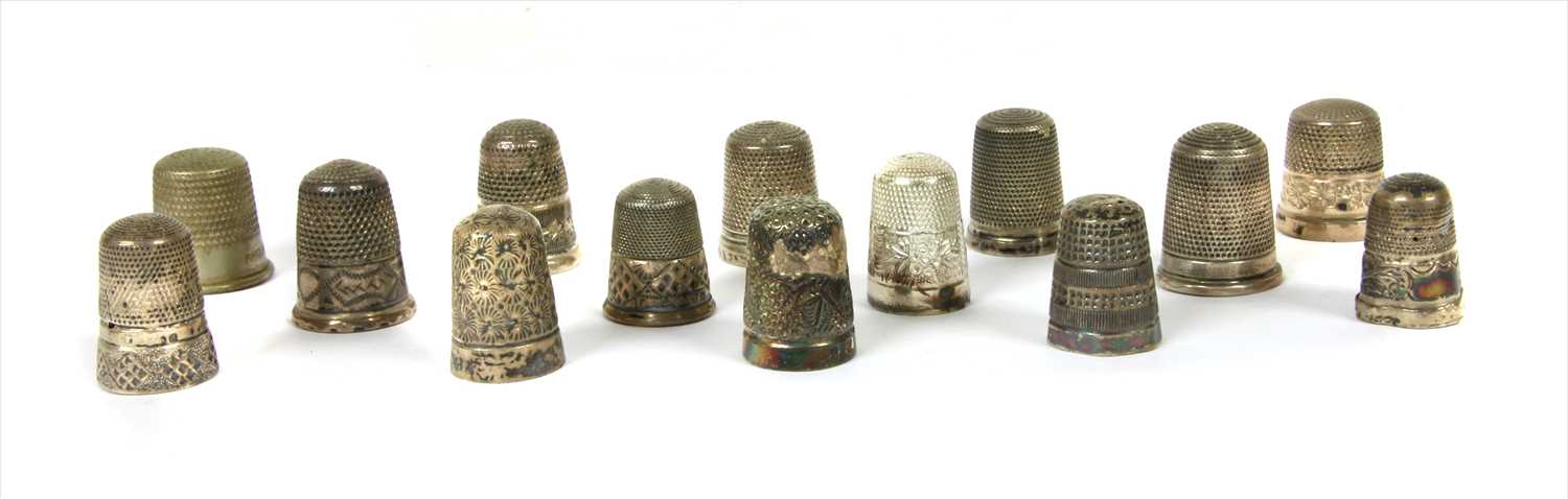Lot 208 - A collection of 14 thimbles